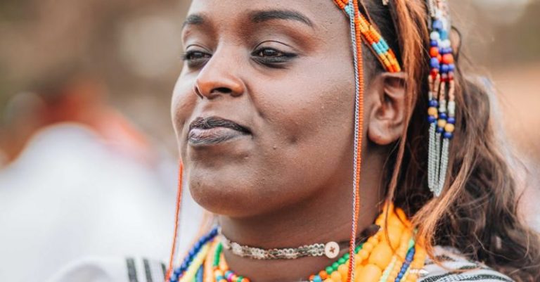 Statement Jewelry - A woman in traditional clothing with colorful headdress