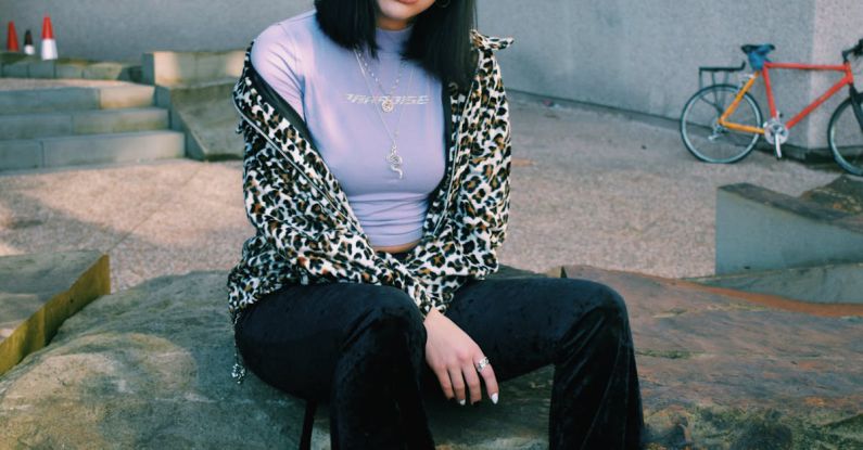 Animal Print - Woman Sitting on Ledge