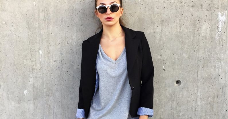 Blazer - Woman Wearing Sunglasses Leaning on Concrete Wall With Left Toe on Wall