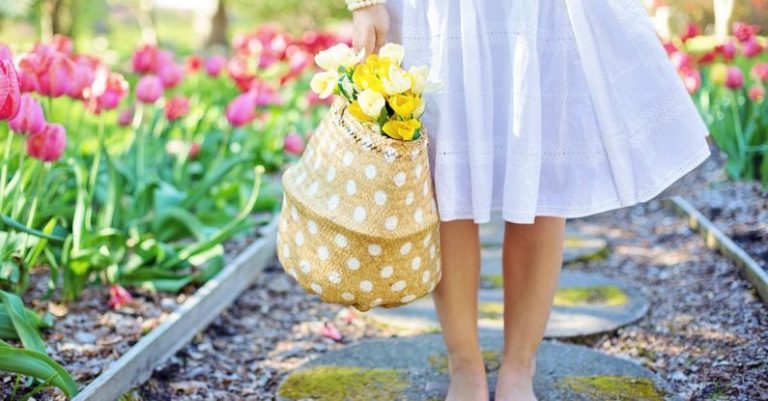 Spring Fashion - Woman Holding Brown Basket With Yellow Flowers