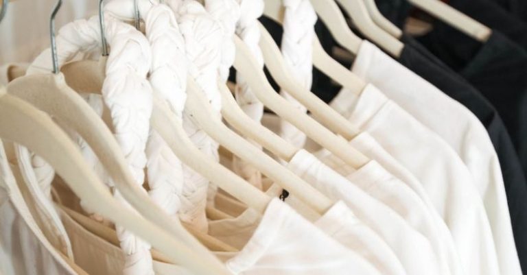 Capsule Wardrobe - Clse-up of Clothes Hanging on a Clothing Rack